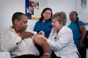A family speaks with a healthcare professional in an exam room during a routine check-up.