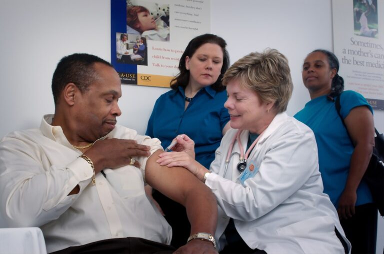 A family speaks with a healthcare professional in an exam room during a routine check-up.